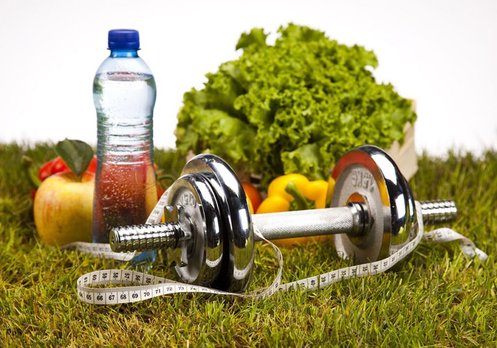 a depiction of healthy living with fruits and vegetables, gym equipment and more. 