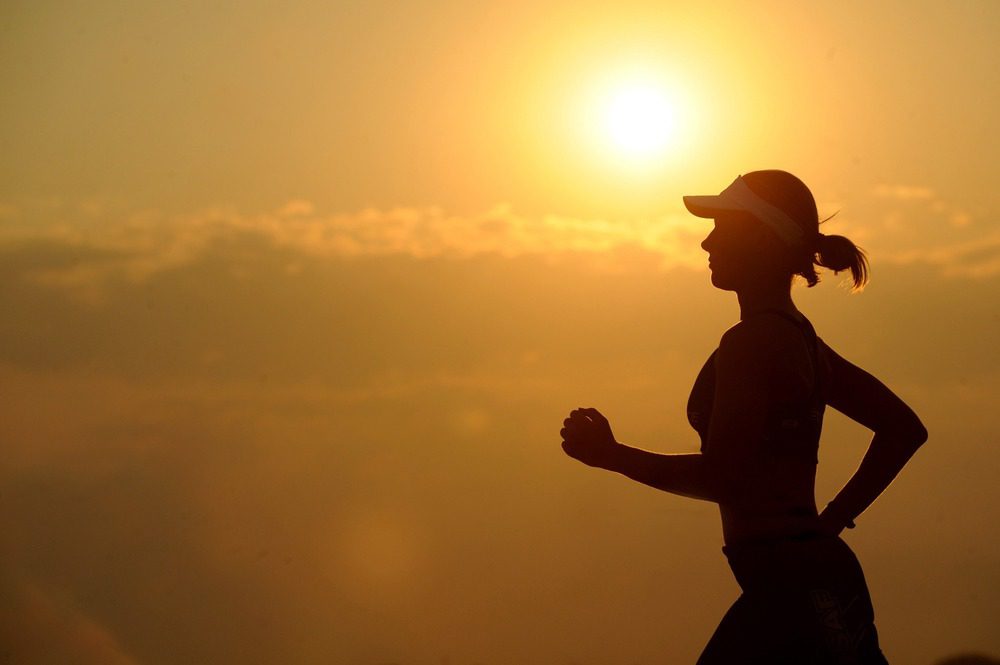 a woman exercising by jogging 