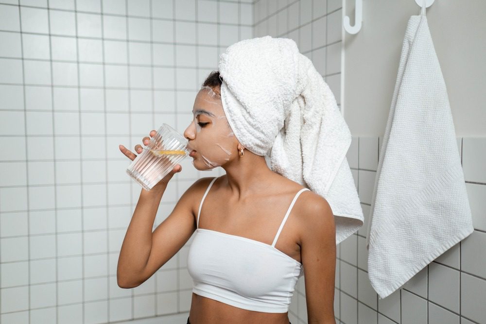 a woman drinking water 